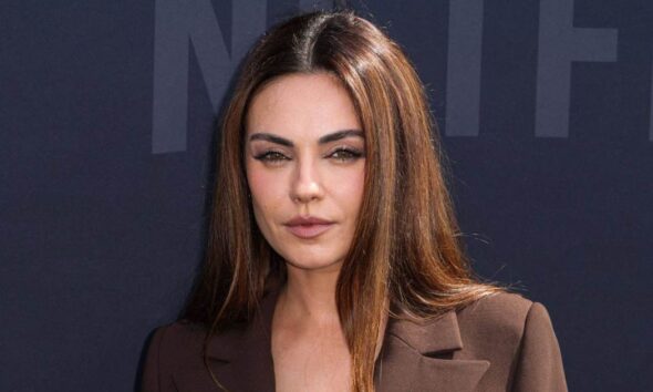 Mila Kunis walks the Netflix 2025 TUDUM red carpet.
