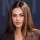 Mila Kunis walks the Netflix 2025 TUDUM red carpet.